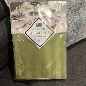 New in package!  Olive green satin stripe tablecloth